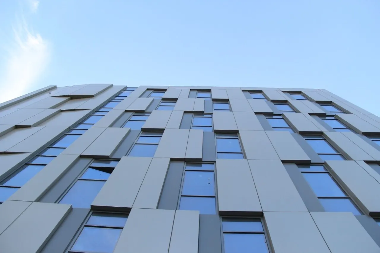 Ibis Baku City — Daytime street perspective showing modern facade articulation and urban corner integration