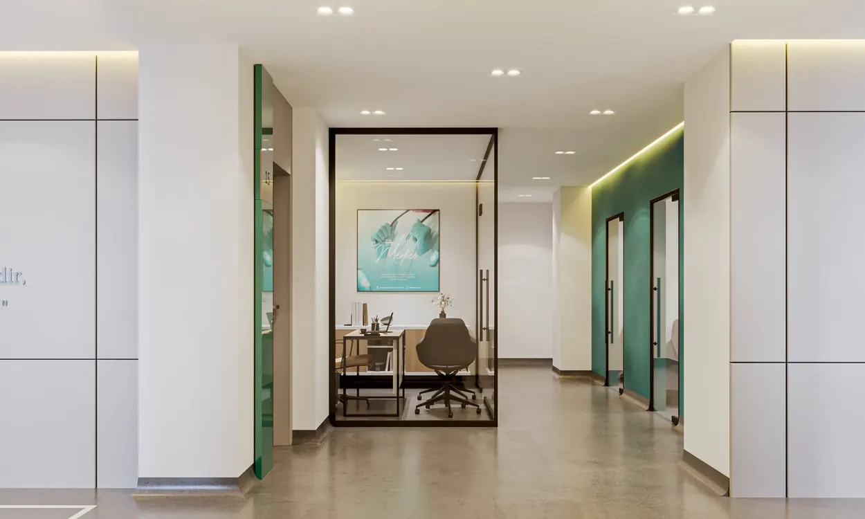 Eurasia Clinique — Specialist consultation office with minimalist medical cabinetry, executive consultation desk, and clinical lighting